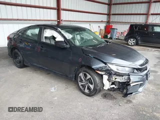 2019 Honda Civic Sedan LX with VIN 19XFC2F6XKE201052, listed as a IAAI auction lot 41961558 with 94,149 mi miles. Bid and sale history available at carsss.com. Image 1.