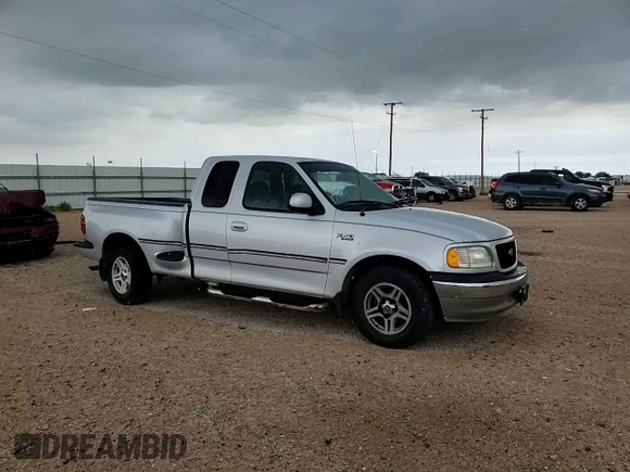 1999 Ford F-150 with VIN 1FTRX07W0XKB88434, listed as a Copart auction lot 60063135 with 277,188 mi miles and Salvage title. Bid and sale history available at DreamBid. Image 14.