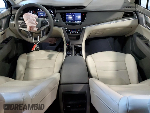 2025 Cadillac XT5 FWD Premium Luxury with VIN 1GYKNCRSXSZ106707, listed as a Copart auction lot 86919854 with 1,879 mi miles and Salvage Title. Bid and sale history available at DreamBid. Image 8.