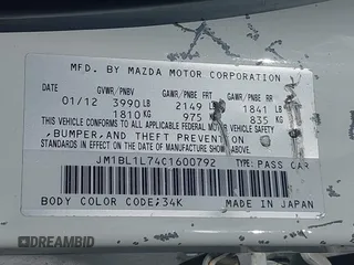 2012 Mazda 3 i Touring z VIN JM1BL1L74C1600792, wystawiony jako IAAI lot #42197953 z przebiegiem 139 930 mil mil oraz . Historia ofert i sprzedaży dostępna na DreamBid. Obrazek 9.