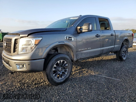 2019 Nissan Titan XD SV with VIN 1N6BA1F4XKN532266, listed as a Copart auction lot 77098244 with 105,965 mi miles and Salvage Title. Bid and sale history available at carsss.com. Image 1.