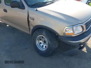 2000 Ford F-150 XL z VIN 1FTRX18W7YNA73804, wystawiony jako IAAI lot #42779753 z przebiegiem 228 666 mil mil oraz . Historia ofert i sprzedaży dostępna na DreamBid. Obrazek 6.