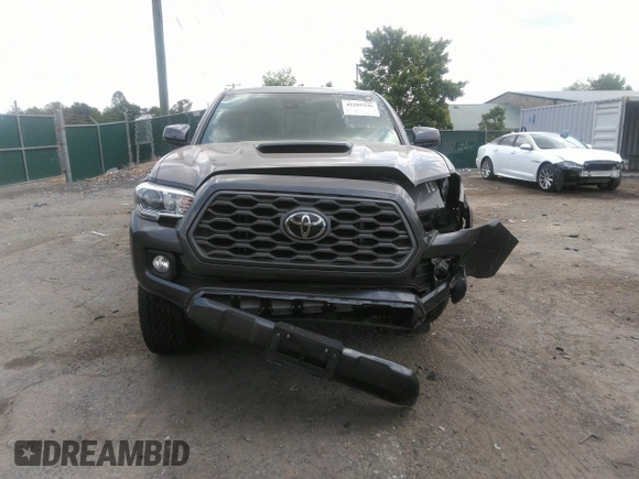 2021 Toyota Tacoma SR z VIN 3TYCZ5AN7MT017377, wystawiony jako IAAI lot #42285326 z przebiegiem 91 657 mil mil oraz . Historia ofert i sprzedaży dostępna na DreamBid. Obrazek 12.