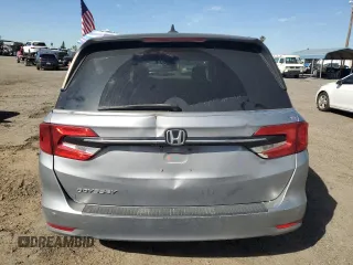 2021 Honda Odyssey EX-L with VIN 5FNRL6H77MB011099, listed as a Copart auction lot 47412535 with 148,004 mi miles and Salvage Title. Bid and sale history available at DreamBid. Image 6.