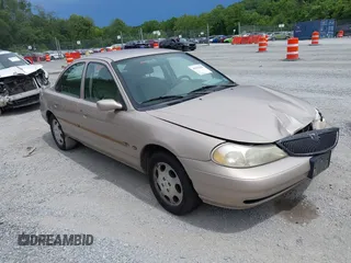 1999 Mercury Mystique GS z VIN 1MEFM6532XK635416, wystawiony jako IAAI lot #42552621 z przebiegiem 184 396 mil mil oraz . Historia ofert i sprzedaży dostępna na DreamBid. Obrazek 1.