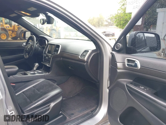 2017 Jeep Grand Cherokee Laredo with VIN 1C4RJEAG0HC702195, listed as a IAAI auction lot 42427597 with 104,403 mi miles and . Bid and sale history available at DreamBid. Image 5.