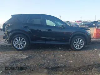 2015 Mazda CX-5 Grand Touring with VIN JM3KE4DY6F0513173, listed as a IAAI auction lot 41867030 with 93,770 mi miles. Bid and sale history available at carsss.com. Image 13.