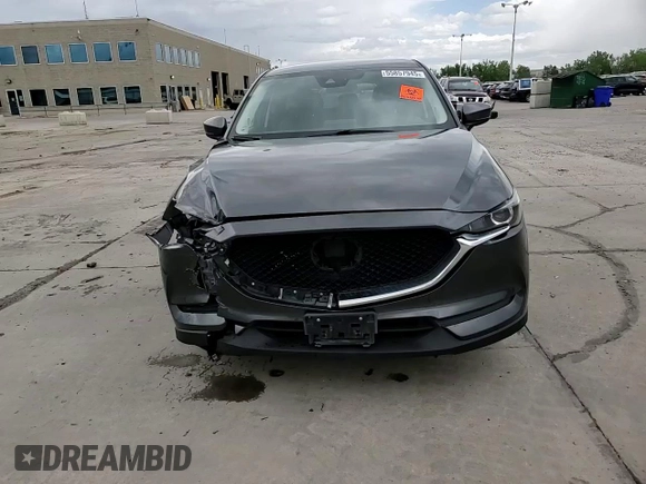 2018 Mazda CX-5 Touring z VIN JM3KFBCM4J0349687, wystawiony jako Copart lot #55857945 z przebiegiem Nie podano mil oraz Szkoda całkowita • Salvage title. Historia ofert i sprzedaży dostępna na DreamBid. Obrazek 14.