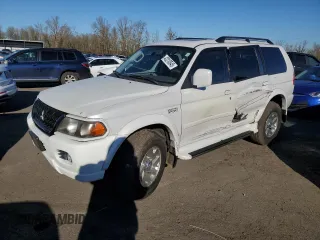 2003 Mitsubishi Montero z VIN JA4MT41RX3J013246, wystawiony jako Copart lot #42210545 z przebiegiem 188 387 mil mil oraz Szkoda całkowita • Salvage title. Historia ofert i sprzedaży dostępna na DreamBid. Obrazek 1.
