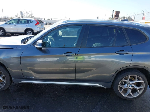 2014 BMW X1 xDrive28i with VIN WBAVL1C57EVY23722, listed as a IAAI auction lot 41839543 with 121,742 mi miles. Bid and sale history available at carsss.com. Image 15.