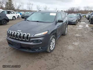 2014 Jeep Cherokee Latitude with VIN 1C4PJLCS2EW319267, listed as a IAAI auction lot 41846074 with 129,668 mi miles. Bid and sale history available at carsss.com. Image 17.
