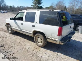 1996 Chevrolet Tahoe Limited with VIN 1GNEC13R0TJ309292, listed as a IAAI auction lot 41412643 with 219,815 mi miles. Bid and sale history available at carsss.com. Image 3.