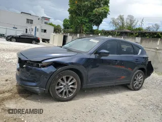 2021 Mazda CX-5 Grand Touring z VIN JM3KFBDM5M0464611, wystawiony jako Copart lot #62829065 z przebiegiem 20 525 mil mil oraz Nie do naprawy • Non repairable. Historia ofert i sprzedaży dostępna na DreamBid. Obrazek 1.