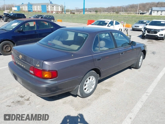 1996 Toyota Camry DX with VIN 4T1BG12K8TU915891, listed as a IAAI auction lot 41874731 with 57,564 mi miles. Bid and sale history available at carsss.com. Image 4.