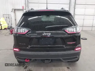 2019 Jeep Cherokee Trailhawk with VIN 1C4PJMBX9KD456748, listed as a IAAI auction lot 42367186 with 91,665 mi miles and . Bid and sale history available at DreamBid. Image 16.