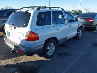2002 Hyundai Santa Fe GLS with VIN KM8SC73D82U294374, listed as a IAAI auction lot 41204011 with 179,219 mi miles. Bid and sale history available at carsss.com. Image 4.