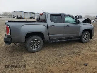 2021 GMC Canyon 4WD AT4 w/Cloth with VIN 1GTG6FEN8M1115918, listed as a Copart auction lot 80592964 with 59,888 mi miles and Salvage Title. Bid and sale history available at carsss.com. Image 3.