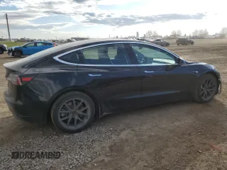 2019 Tesla Model 3 Mid Range z VIN 5YJ3E1EA7KF420025, wystawiony jako Copart lot #56149015 z przebiegiem 253 771 mil mil oraz Szkoda całkowita • Salvage title. Historia ofert i sprzedaży dostępna na DreamBid. Obrazek 3.