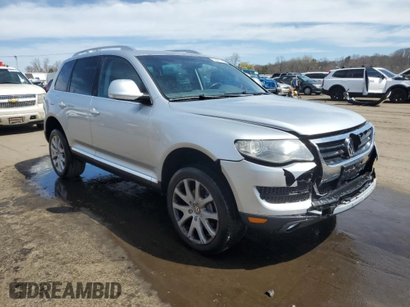 2010 Volkswagen Touareg VR6 with VIN WVGBF7A97AD004355, listed as a Copart auction lot 52861335 with 129,454 mi miles and Salvage Title. Bid and sale history available at DreamBid. Image 4.