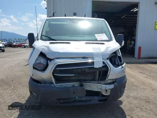 2020 Ford Transit Cargo z VIN 1FTYE1Y80LKB53684, wystawiony jako IAAI lot #42556377 z przebiegiem 102 801 mil mil oraz . Historia ofert i sprzedaży dostępna na DreamBid. Obrazek 13.