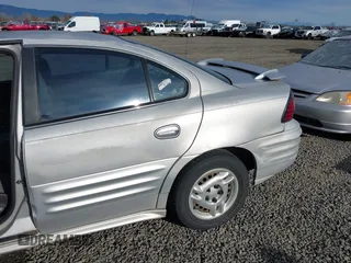 2001 Pontiac Grand Am SE1 with VIN 1G2NF52TX1M560650, listed as a IAAI auction lot 41654339 with 122,885 mi miles. Bid and sale history available at carsss.com. Image 6.