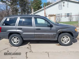 2003 Jeep Grand Cherokee Laredo with VIN 1J4GX48S53C504225, listed as a IAAI auction lot 41879669 with 247,246 mi miles. Bid and sale history available at carsss.com. Image 14.