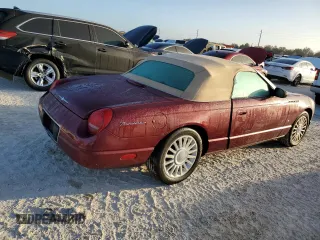 2004 Ford Thunderbird Deluxe with VIN 1FAHP60A14Y111339, listed as a Copart auction lot 77588194 with Not Provided miles and Salvage Title. Bid and sale history available at DreamBid. Image 3.