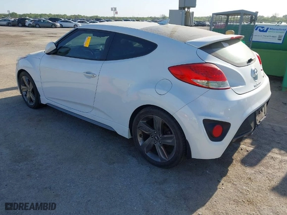 2015 Hyundai Veloster Turbo with VIN KMHTC6AE5FU228008, listed as a IAAI auction lot 42016707 with 122,507 mi miles. Bid and sale history available at carsss.com. Image 3.