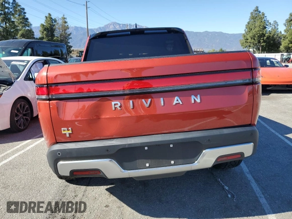 2023 Rivian R1T Adventure z VIN 7FCTGAAA0PN024599, wystawiony jako Copart lot #50269955 z przebiegiem Nie podano mil oraz Szkody całkowita. Historia ofert i sprzedaży dostępna na DreamBid. Obrazek 6.