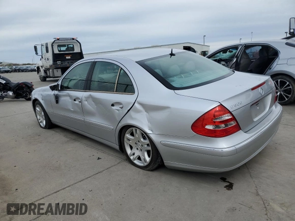 2003 Mercedes-Benz E-Class 5.0L with VIN WDBUF70J03A112909, listed as a Copart auction lot 49924865 with 158,244 mi miles and Salvage Title. Bid and sale history available at carsss.com. Image 2.