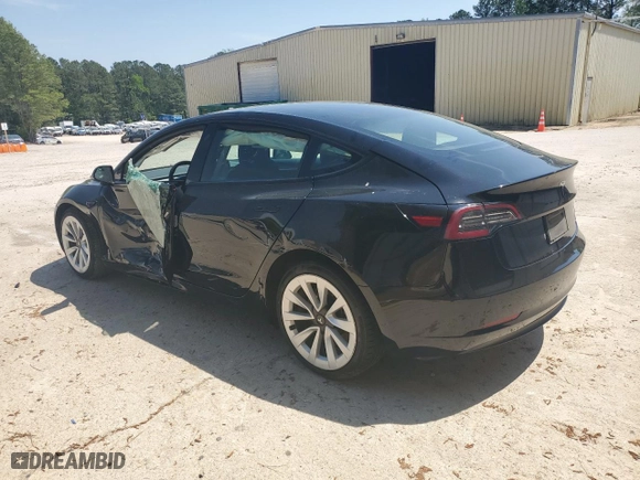 2023 Tesla Model 3 with VIN 5YJ3E1EA2PF438438, listed as a Copart auction lot 52901375 with 63,181 mi miles and Salvage Title. Bid and sale history available at carsss.com. Image 2.