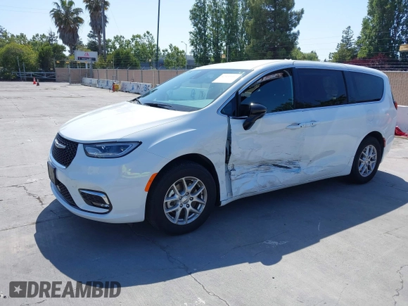 2024 Chrysler Pacifica Touring with VIN 2C4RC1FG7RR194974, listed as a IAAI auction lot 42459547 with 13,200 mi miles and . Bid and sale history available at DreamBid. Image 2.