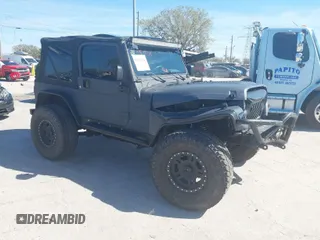 2003 Jeep Wrangler X with VIN 1J4FA39S03P314685, listed as a IAAI auction lot 41649741 with 119,924 mi miles. Bid and sale history available at carsss.com. Image 1.