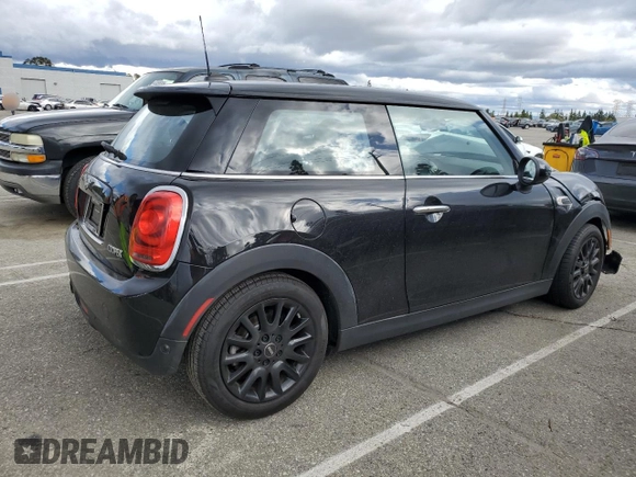 2019 MINI Hardtop Cooper with VIN WMWXP5C56K2H31697, listed as a Copart auction lot 48826655 with 60,190 mi miles and Salvage title. Bid and sale history available at DreamBid. Image 3.
