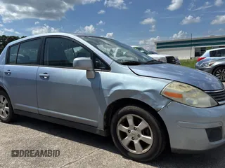 2009 Nissan Versa S with VIN 3N1BC13E99L412868, listed as a Copart auction lot 63712925 with 214,080 mi miles and Clean title. Bid and sale history available at DreamBid. Image 1.