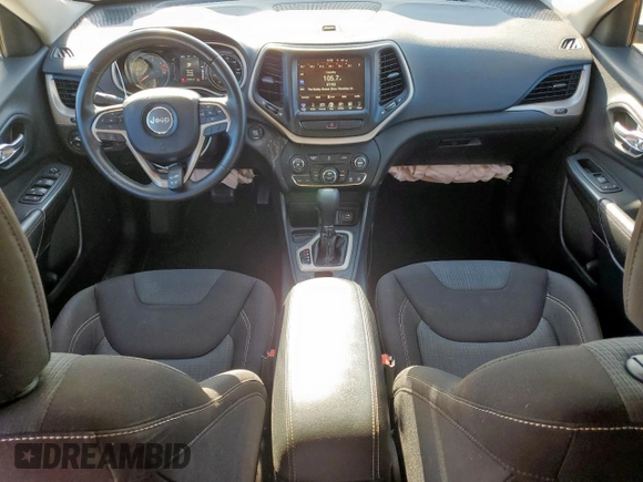 2016 Jeep Cherokee Latitude with VIN 1C4PJLCB8GW125748, listed as a Copart auction lot 60697145 with 118,276 mi miles and Salvage title. Bid and sale history available at DreamBid. Image 8.