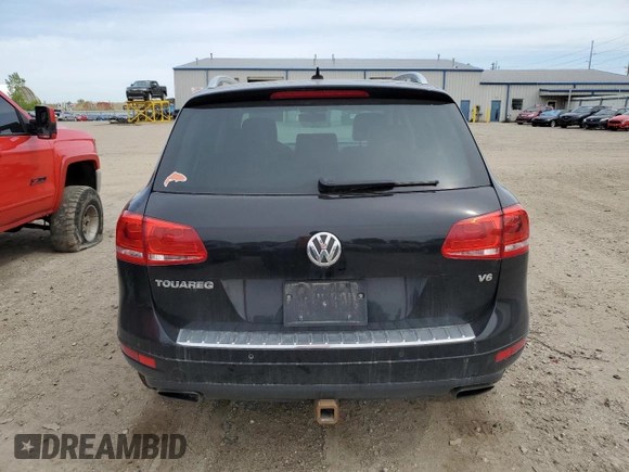 2012 Volkswagen Touareg Sport with VIN WVGFF9BP8CD001039, listed as a Copart auction lot 57764125 with 128,540 mi miles and Clean title. Bid and sale history available at DreamBid. Image 6.