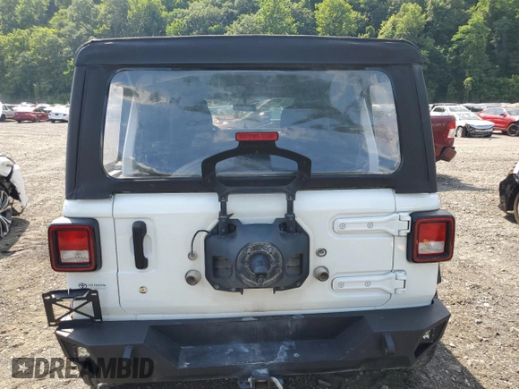 2023 Jeep Wrangler Sport with VIN 1C4HJXDGXPW596127, listed as a Copart auction lot 65395655 with 64,257 mi miles and Salvage title. Bid and sale history available at DreamBid. Image 6.