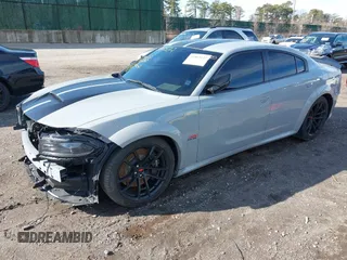2022 Dodge Charger Scat Pack Widebody with VIN 2C3CDXGJ6NH176650, listed as a IAAI auction lot 41863122 with 34,569 mi miles and . Bid and sale history available at DreamBid. Image 18.