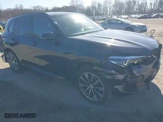 2021 BMW X5 xDrive40i with VIN 5UXCR6C09M9F83785, listed as a IAAI auction lot 41828697 with 57,863 mi miles. Bid and sale history available at carsss.com. Image 1.