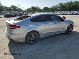 2019 Ford Fusion Titanium with VIN 3FA6P0RU1KR209297, listed as a Copart auction lot 54358065 with 122,600 mi miles and Salvage Title. Bid and sale history available at DreamBid. Image 3.