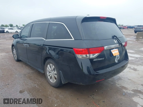 2014 Honda Odyssey EX-L with VIN 5FNRL5H64EB114709, listed as a IAAI auction lot 42131146 with 145,616 mi miles and . Bid and sale history available at DreamBid. Image 3.