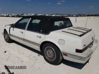 1991 Cadillac Seville z VIN 1G6KS53B9MU824142, wystawiony jako Copart lot #74276264 z przebiegiem 103 517 mil mil oraz Szkody całkowita. Historia ofert i sprzedaży dostępna na DreamBid. Obrazek 2.
