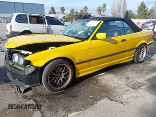 1997 BMW 3-Series 328IC with VIN WBABK8323VET99797, listed as a IAAI auction lot 41616423 with 177,621 mi miles. Bid and sale history available at carsss.com. Image 2.
