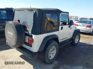 2005 Jeep Wrangler SE with VIN 1J4FA29S95P363770, listed as a IAAI auction lot 41362056 with 140,540 mi miles. Bid and sale history available at carsss.com. Image 4.
