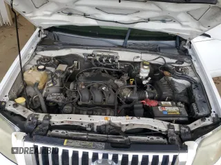 2008 Mercury Mariner Premier z VIN 4M2CU97188KJ23673, wystawiony jako Copart lot #64282185 z przebiegiem 198 511 mil mil oraz Szkoda całkowita • Salvage title. Historia ofert i sprzedaży dostępna na DreamBid. Obrazek 11.