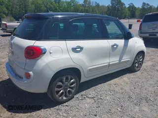 2014 FIAT 500L Lounge with VIN ZFBCFACH8EZ005469, listed as a IAAI auction lot 42002547 with 114,769 mi miles. Bid and sale history available at carsss.com. Image 4.