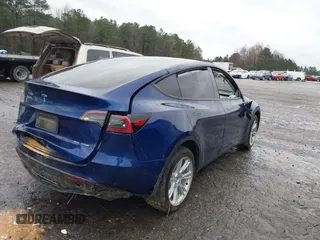 2023 Tesla Model Y Long Range with VIN 7SAYGDEE7PF673988, listed as a IAAI auction lot 41057651 with 29,683 mi miles and . Bid and sale history available at DreamBid. Image 4.