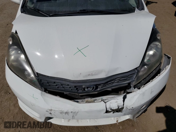 2012 Honda Fit Sport with VIN JHMGE8H50CC009958, listed as a Copart auction lot 55423075 with 117,618 mi miles and Salvage Title. Bid and sale history available at DreamBid. Image 11.