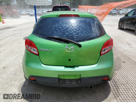 2012 Mazda 2 Sport with VIN JM1DE1KZ5C0141784, listed as a Copart auction lot 56498295 with 132,602 mi miles and Salvage Title. Bid and sale history available at DreamBid. Image 6.
